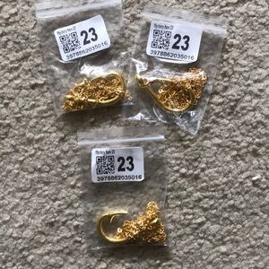 Three golden anchor necklaces